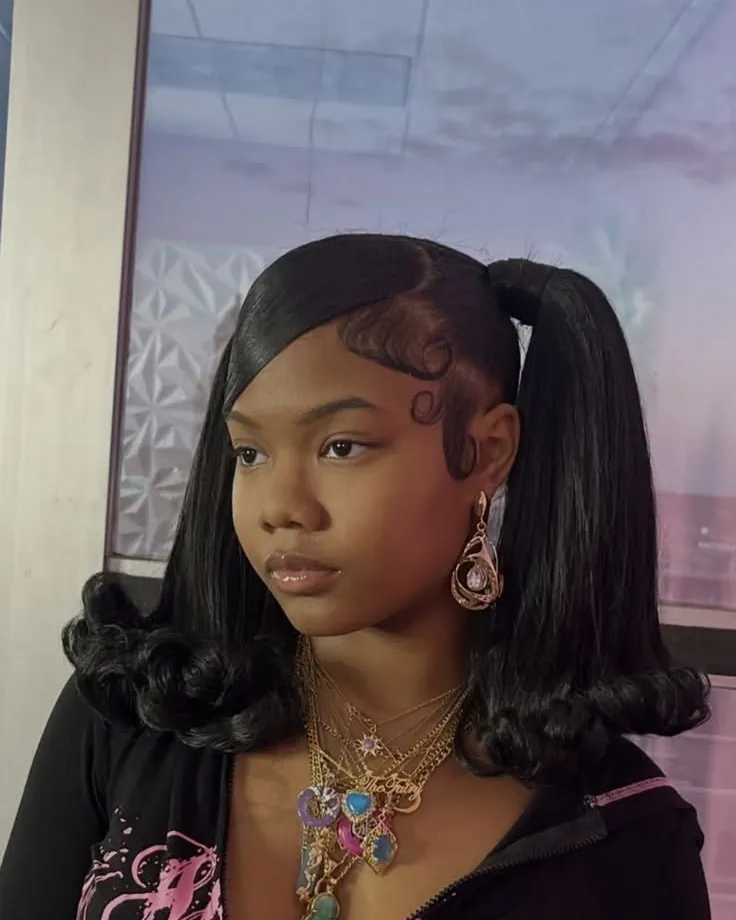 Woman with sleek pigtails and flipped ends