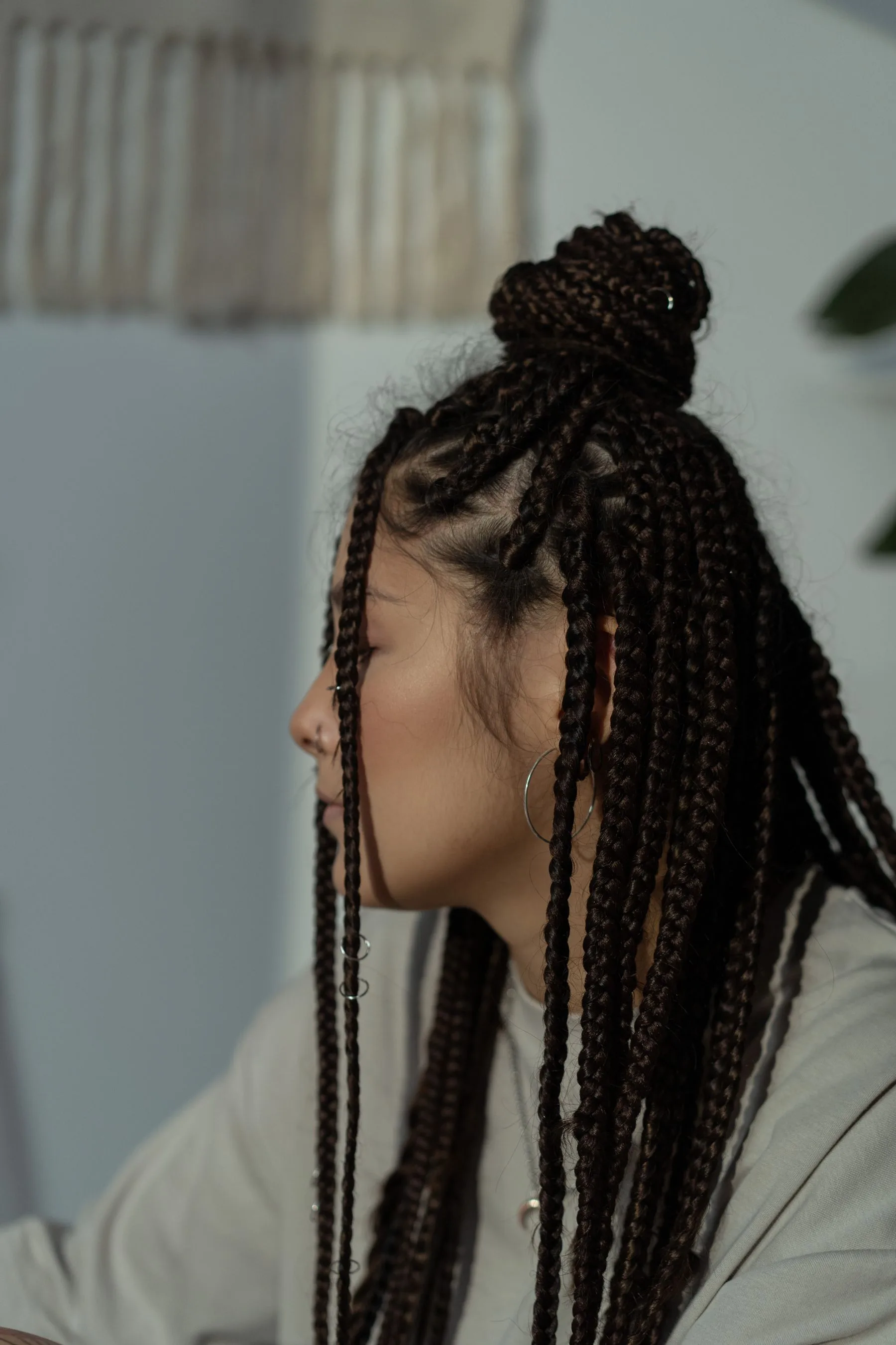 Side profile of a woman with an intricate braided style